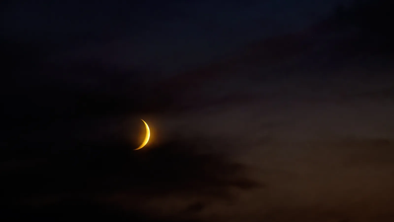 Glowing crescent moon over zodiac wheel symbolizing moon sign meaning and emotions